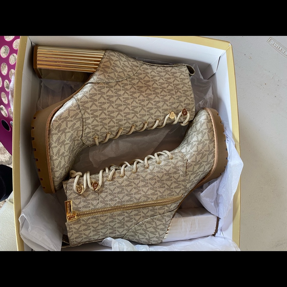 Size 8 Micheal Kors gold Porter Lace Up Bootie. Never worn.